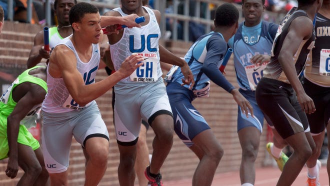 Union Catholic's Jakell Henderson hands off to Taylor Henderson during the High School Boys 4X400 race on Saturday at Penn Relays in Philadelphia Pa. on April 25, 2015. Peter Ackerman/Staff Photographer
