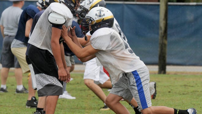 Members of the Eau Gallie High football team go through drills during practice Thursday afternoon. 