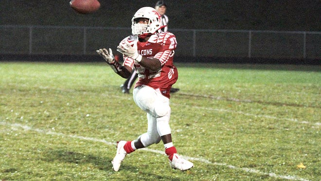 Davonte Conley hauls in a touchdown pass in the first quarter against Coloma on Friday.