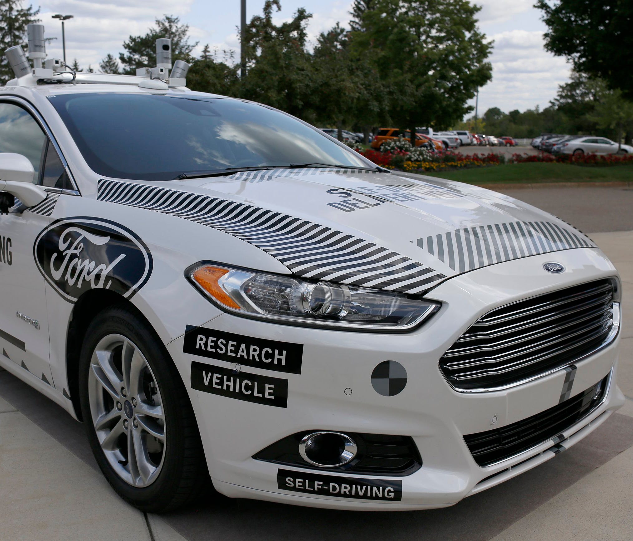 The Ford Fusion hybrid autonomous research vehicle, which will be used as the self-driving pizza delivery vehicle.
