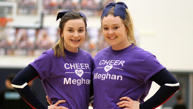 Sophomore Maison, left, and senior Ashton Treadwell had the opportunity to cheer together this past season.
