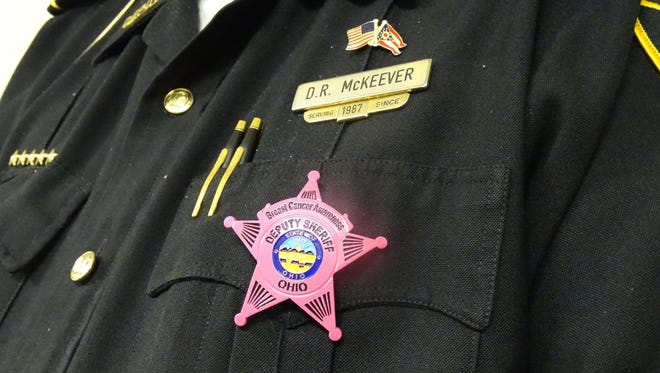 More than 100 employees of the Ross County Sheriff's Office are sporting pink badges to show support for Breast Cancer Awareness Month.