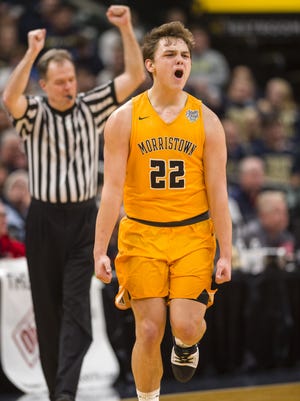 Morristown High School junior guard Logan Laster (22) reacts after hitting a three-point basket during the first half of the IHSAA Boys' Basketball Class A State Finals game at Bankers Life Fieldhouse, Saturday, March 24, 2018.