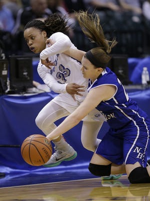 Heritage Christian Eagles DaShawna Harper (23) and North Harrison Lady Cats Hallie Hinton (23) battle for a loose ball in the first half of their 3A IHSAA Girls Basketball State Finals Saturday, Feb 27, 2016, afternoon at Bankers Life Fieldhouse.