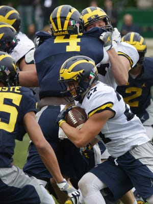 Tru Wilson runs the ball during the Wolverines' second practice during U-M's trip to Rome in April 2017.