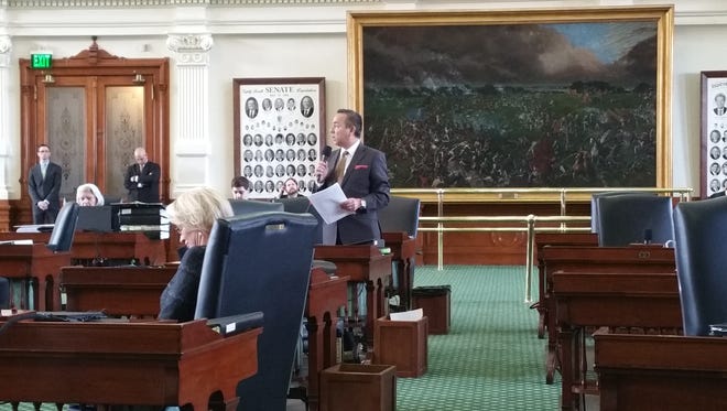 State Sen. Carlos Uresti, D-San Antonio, speaks Wednesday in opposition to Senate Bill 4 just before the Texas Senate gave final approval to the controversial sanctuary cities legislation.