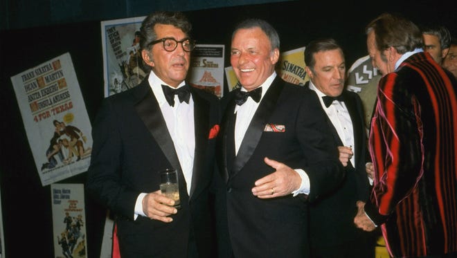 FILE--Dean Martin and Frank Sinatra are shown at the Friars Club in New York, Feb. 23, 1976.  Sinatra, hospitalized last week for a pinched nerve, reportedly was in deteriorating health and being treated for pneumonia and heart failure. KCBS-TV, citing an unidentified hospital source, said Sinatra s private room at Cedars Sinai Medical Center resembled an intensive care unit. Sinatra, 80, was hospitalized Nov. 1. (AP Photo/stf)