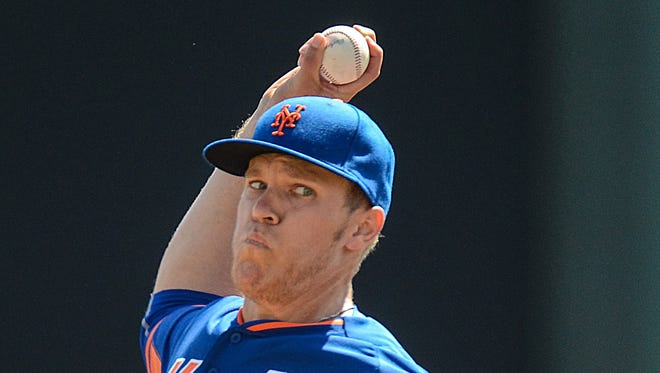 New Yorks Mets pitcher  Noah Syndergaard (55) warms up before the spring training exhibition game against the Atlanta Bravesat Champion Stadium.