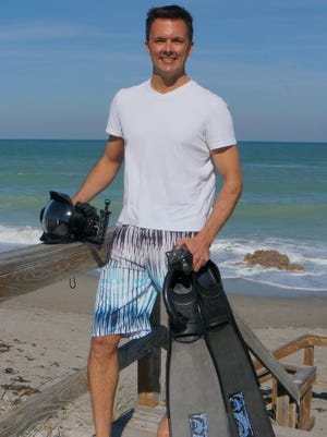 Paul Dabill with his camera rig and diving equipment