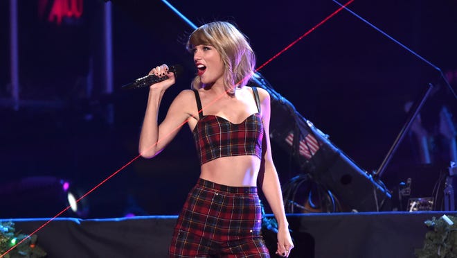 NEW YORK, NY - DECEMBER 12:  Taylor Swift performs onstage during iHeartRadio Jingle Ball 2014, hosted by Z100 New York and presented by Goldfish Puffs at Madison Square Garden on December 12, 2014 in New York City.  (Photo by Mike Coppola/Getty Images for iHeartMedia) ORG XMIT: 526582263 ORIG FILE ID: 460394392