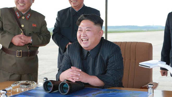 North Korean leader Kim Jong Un, center, attends what was said to be the test launch of an intermediate range Hwasong-12 missile at an undisclosed location in North Korea. U.S President Donald Trump announced Feb. 5, 2019 during his State of the Union address that he intends to meet Kim on Feb. 27-28, 2019 in Vietnam, saying that although much work remains to be done toward peace on the Korean Peninsula, his relationship with Kim is a good one.