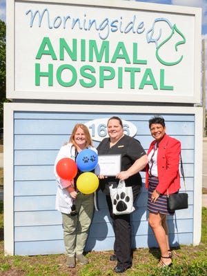 Morningside Animal Hospital's Dr. Kari Kelly, Jade Monroe and Angella Williams.