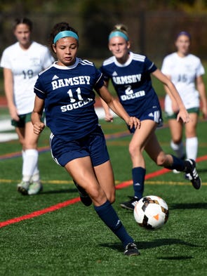 Ramsey's Alex Correa #11 dribbles away from pressure