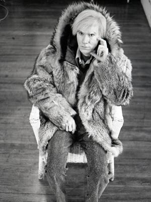 Michael Childers took this photo of Andy Warhol in his New York studio after Warhol showed an attraction to a fur coat. The photo is included in the Palm Springs Art Museum's "Photographs of Michael Childers: Having A Ball."