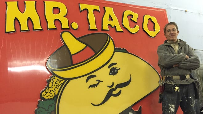 Bill Bonofiglo poses in front of the Mr. Taco sign. He plans to reopen the restaurant. He was recently filed a lawsuit to protect the recipes of the restaurant.