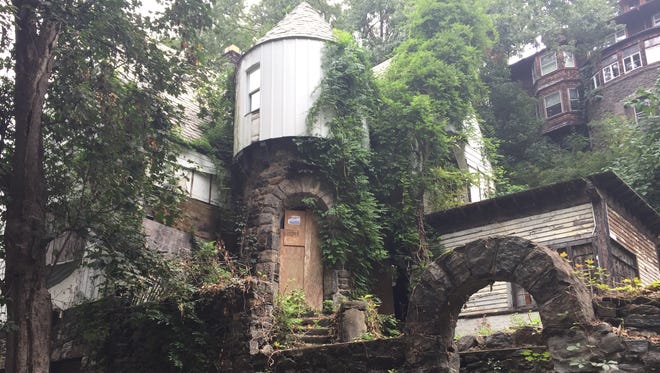 The owner of a derelict house at 58 Park Hill Terrace in Yonkers wants to raze it and city records indicate that the house is a historic landmark.
