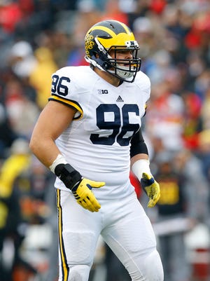 Michigan defensive lineman Ryan Glasgow walks on the field in the first half of an NCAA college football game against Maryland, Saturday, Oct. 3, 2015, in College Park, Md.