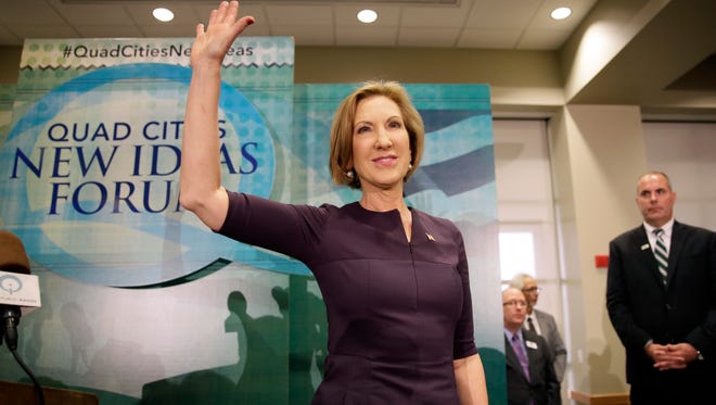 Republican presidential candidate Carly Fiorina waves to supporters after speaking at the Quad Cities New Ideas Forum, Friday, Sept. 25, 2015, in Davenport, Iowa. (AP Photo/Charlie Neibergall)