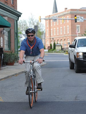 Matt Drew, head of the Bike-SBY group advocates for bike lanes in and around Salisbury, bikes on South Division Street near Route 50 in this 2012 photo.