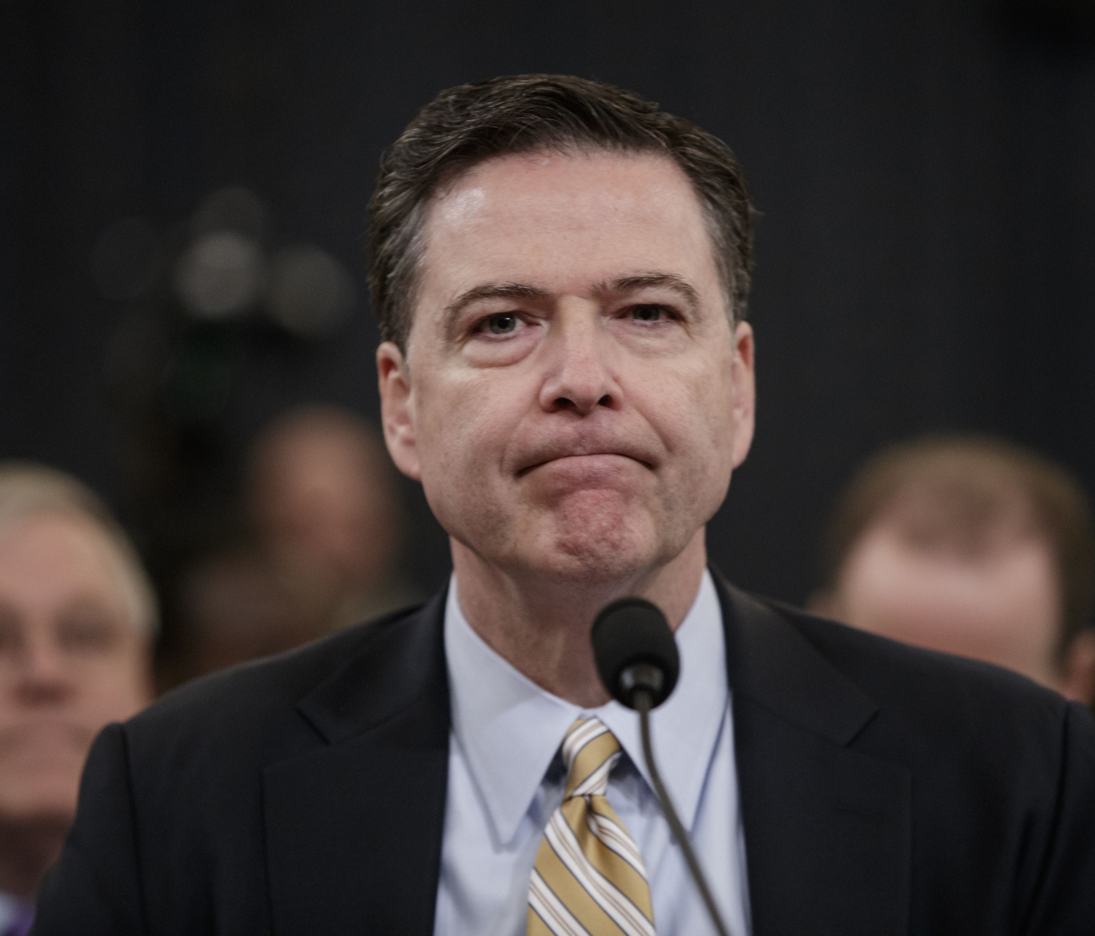 FBI Director James Comey pauses as he testifies March 20, 2017 before the House Intelligence Committee hearing on allegations of Russian interference in the 2016 U.S. presidential election.  Comey' will testify again Thursday before the Senate Intell