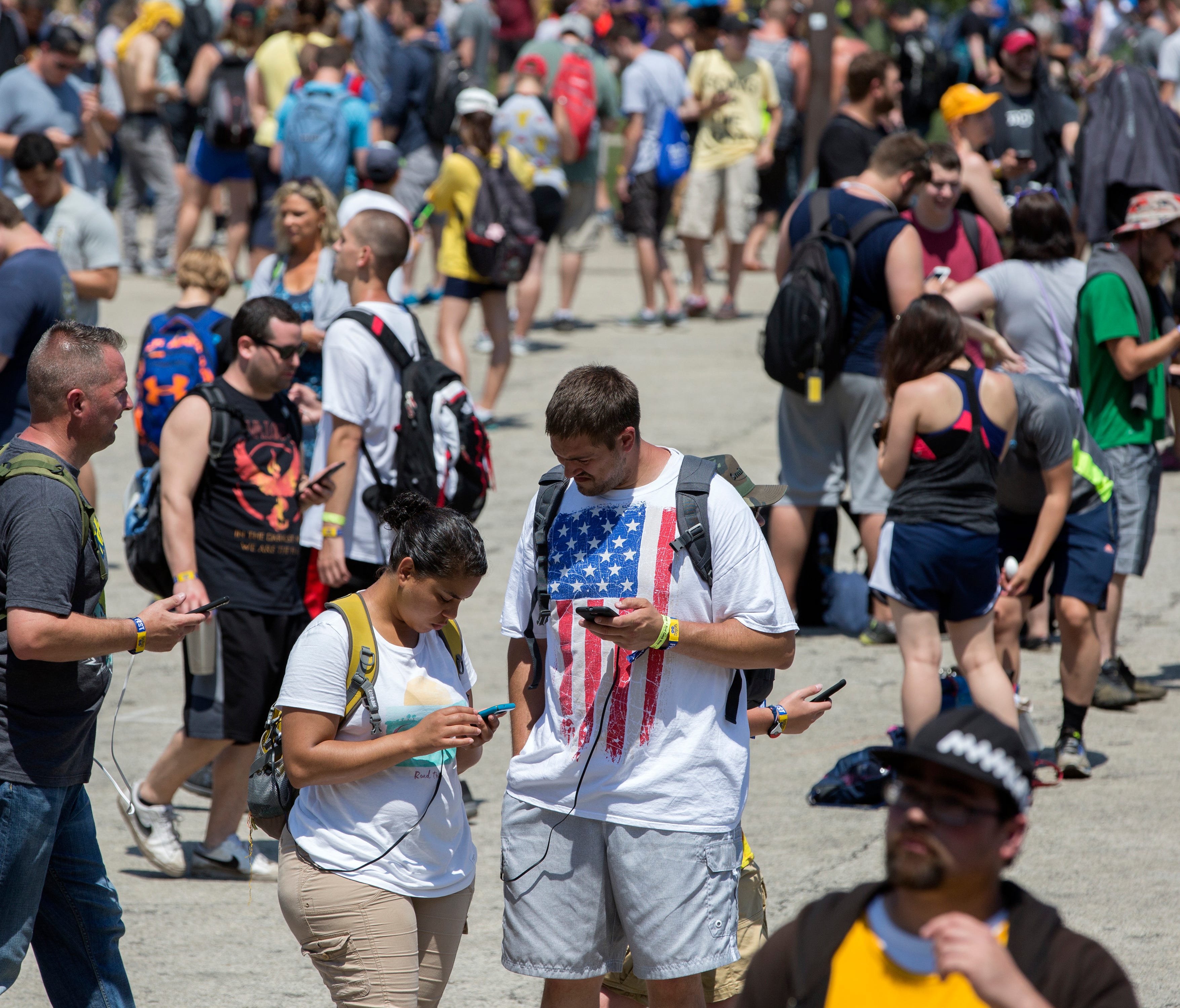 Festival goers wander the grounds at the Pokemon Go Fest Saturday, July 22, 2017, at Grant Park in Chicago. Many festival attendees had trouble getting the augmented-reality cellphone game to work.