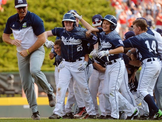 The Red Land Little League team celebrates the walk-off