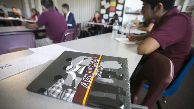 A yearbook sits on a desk in a senior English class at ASU Preparatory Academy in Phoenix on May 26, 2015.