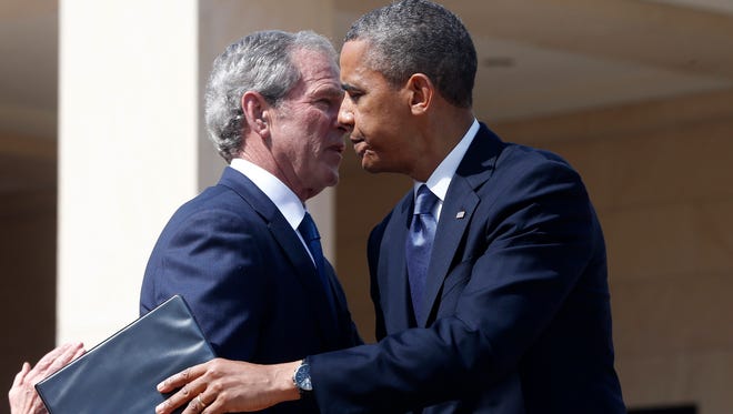 President Obama embraces former president George W. Bush  at the dedication of the George W. Bush presidential library on the campus of Southern Methodist University in Dallas April 25. Bush told Fox News on Friday that Obama has a tough choice to make on Syria.