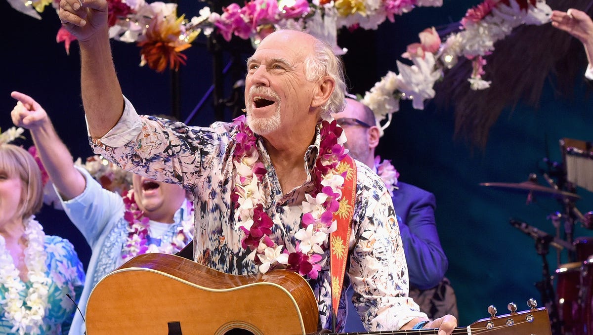 Jimmy Buffett took an opening night bow during the Broadway premiere of 'Escape to Margaritaville,' the new musical featuring his songs in New York. In an interview with 'Hamilton' creator LIn-Manuel Miranda, Buffett joked that he would love to play King George III in the Tony-winning musical.