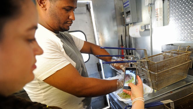 Ibrahim and Melissa Hamed with Hunny and Bunny uses social media to promote her food truck during Sioux Falls Made at Argus Leader in Sioux Falls, S.D., Friday, May 1, 2015.