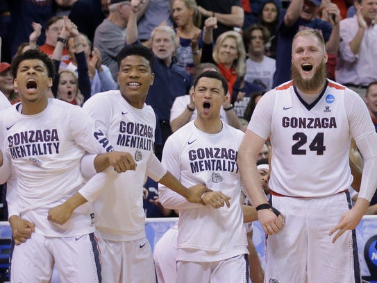 The Gonzaga bench celebrates during the second half