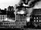 Flames and smoke shoot skyward from Brewster Building