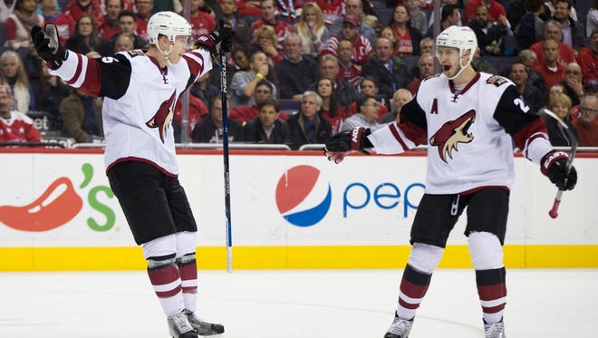 Arizona Coyotes defenseman Connor Murphy, left, celebrates his third period goal against the Washington Capitals with teammate Oliver Ekman-Larsson during an NHL hockey game, on Monday, Feb. 22, 2016, in Washington. The Capitals defeated the Coyotes 3-2.