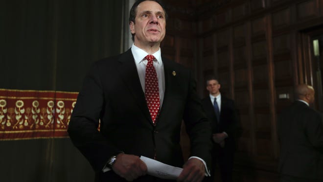 New York Gov. Andrew Cuomo leaves a news conference in the Red Room at the Capitol on Wednesday, March 18, 2015, in Albany, N.Y.