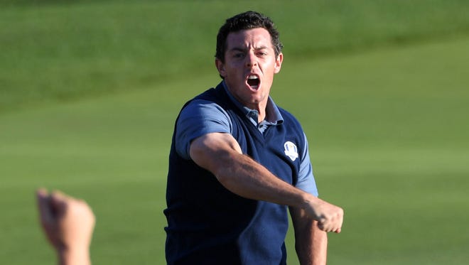 Rory McIlroy celebrates his afternoon win.