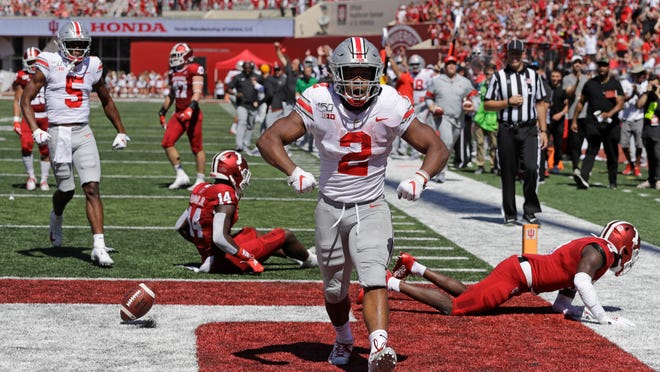 FILE - In this Sept. 14, 2019, file photo, Ohio State running back J.K. Dobbins (2) celebrates after scoring a touchdown during the first half of an NCAA college football game against Indiana, in Bloomington, Ind. Dobbins has rushed for 425 yards and four touchdowns while averaging 7.1 yards per carry. No. 6 Ohio State knows the games are going to get harder eventually, but so far everything has just seemed, well, so easy. (AP Photo/Darron Cummings, File)