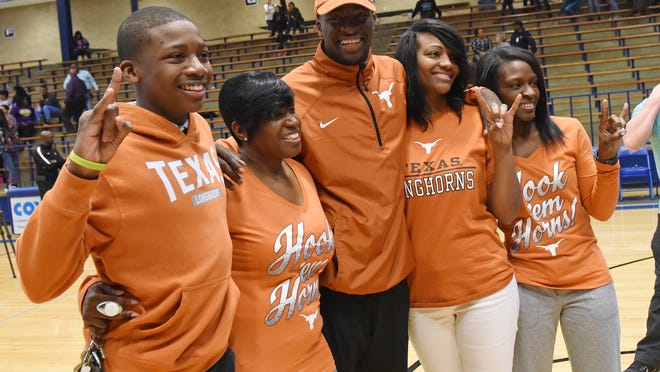 Jamarion Miller (far left) celebrates with family members after his older brother, Damion, signs with Texas on Feb. 1, 2017. Now a star running back at Tyler Legacy High, Jamarion has announced that he will play football for the Longhorns.