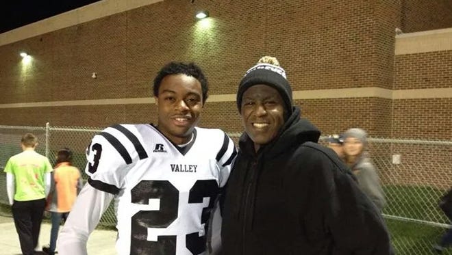 
Roy Marble Sr., right, poses with his youngest son, Carlo, a junior who transferred to Sexton High from West Des Moines, Iowa, in early October. 
