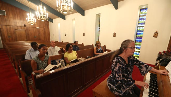 D.L. Laseur leads the choir during rehearsal at St. Michael & All Angels Episcopal Church in Tallahassee, which is celebrating its 135th Anniversary on Friday, Sept. 29.