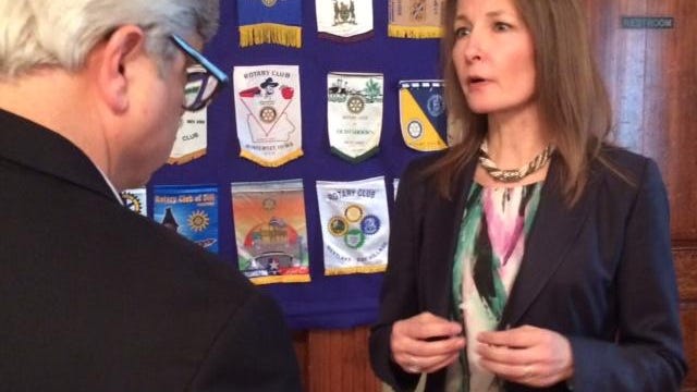 Adrienne C. Slack of the Federal Reserve Bank of Atlanta, New Orleans branch, answers questions after a presentation to the Rotary Club.