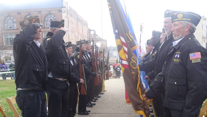 Members of the Coshocton County Honor Guard stand at attention during a previous Veterans Day ceremony.