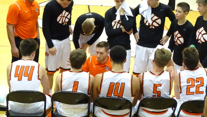 Amanda-Clearcreek coach Cody Carpenter gives his team instructions during a timeout Wednesday in the Aces' 71-36 non-conference win over Federal Hocking.
