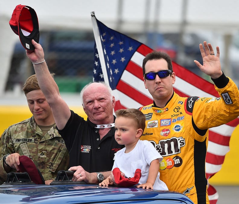 Kyle Busch and his son Brexton prior to the Coca-Cola 600 at Charlotte Motor Speedway. Mandatory Credit: