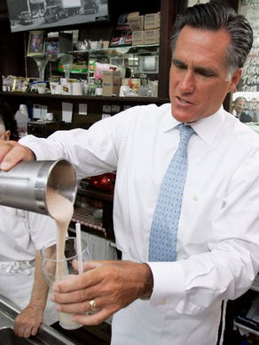 Mitt Romney pours a milkshake during a visit to the Wilton Candy Kitchen in Wilton, Iowa, on Aug. 8, 2007.