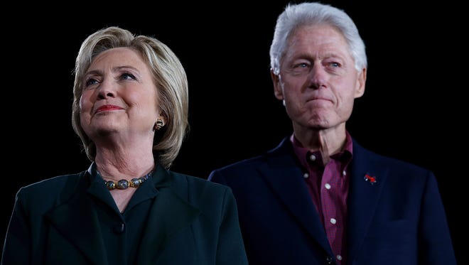 In this Feb. 19, 2016, file photo, Democratic presidential nominee Hillary Clinton and her husband, former President Bill Clinton, look on during a "Get Out The Caucus" at the Clark County (Nevada) Government Center Las Vegas.