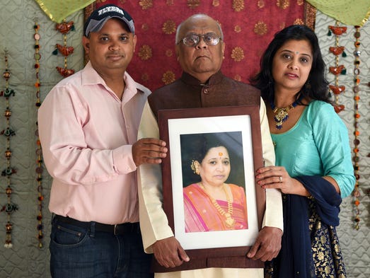 Kaushal and Neha with their father Dharnedra Shah hold