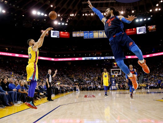 Feb. 24: Warriors guard Steph Curry shoots over Thunder