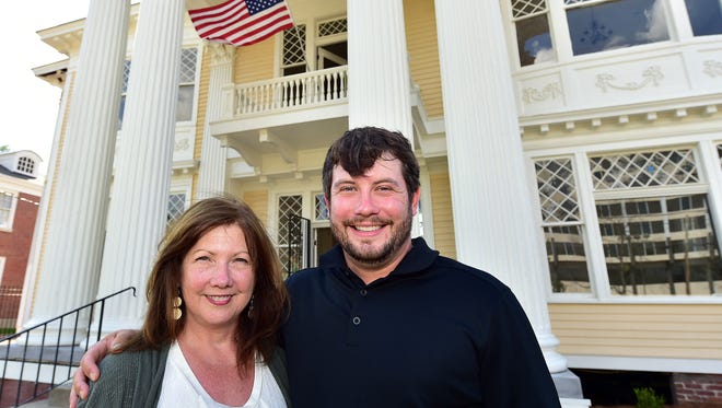 Beasley Properties partners Carole and Holt Beasley stand Wednesday in front of the Merrill-Beasley Building — previously called the Merrill-Maley House — in Jackson, which will be leased as office or commercial space. The home, built in 1907, is nearing completion of its restoration.