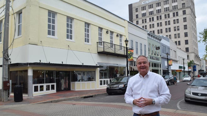 Greg Trotter stands in front of several storefronts he and business partner Duana Juneau have renovated on the 1000 block of Third Street.