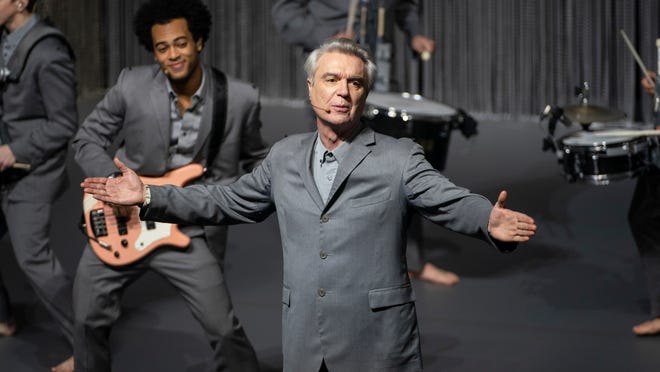 David Byrne fronts his barefooted cast of musicians.